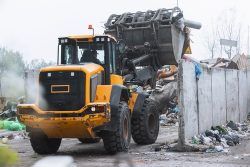 Yellow,Skid,Steer,Loader,Moving,Wooden,Waste,Material,,Shaking,Out