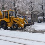 Yellow,Tractor,With,Snowplow,Removing,Snow,From,The,Streets.